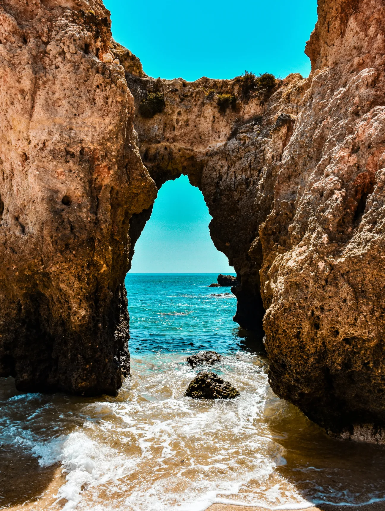 Image of a beach with a pebble hole